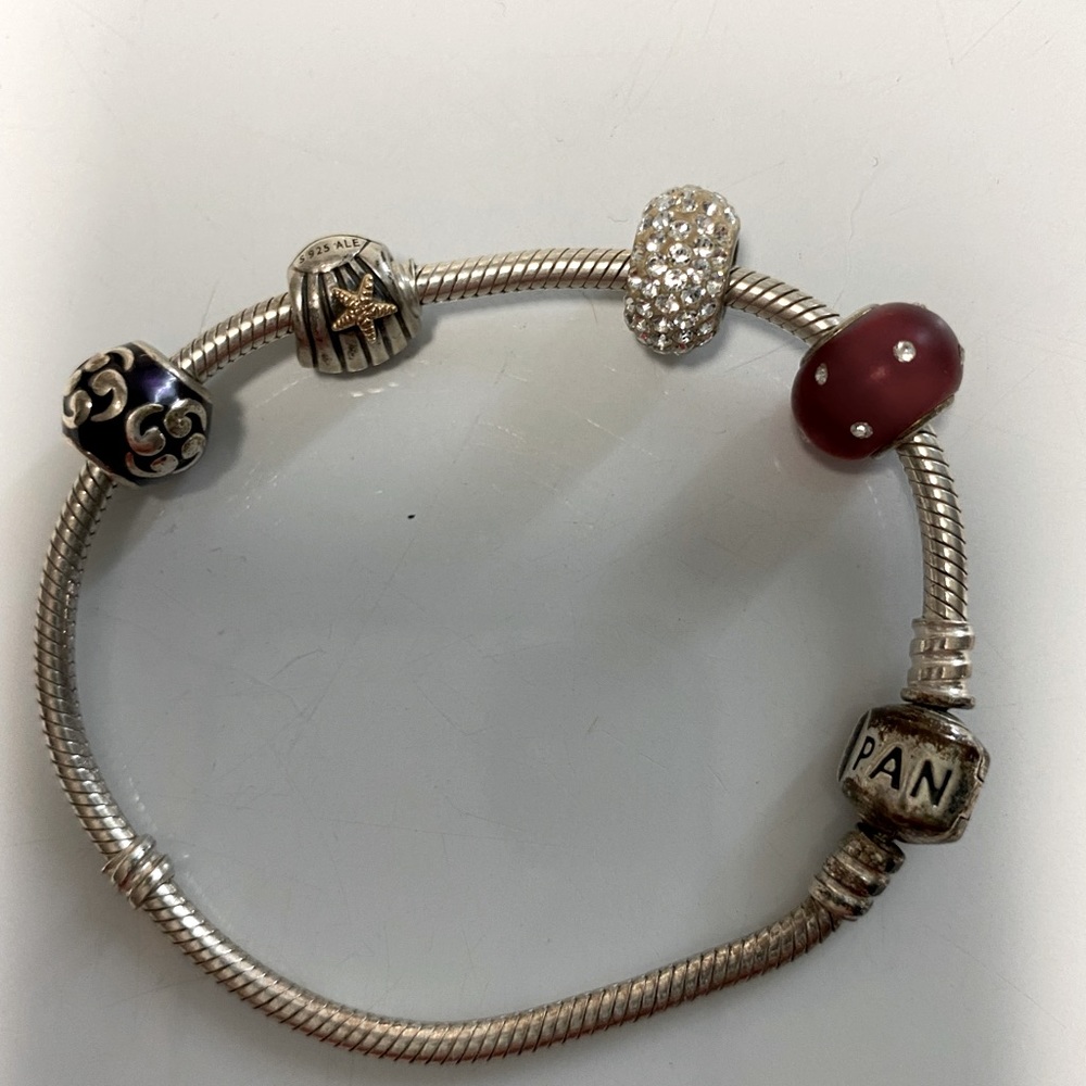 pandora bracelet with four charms